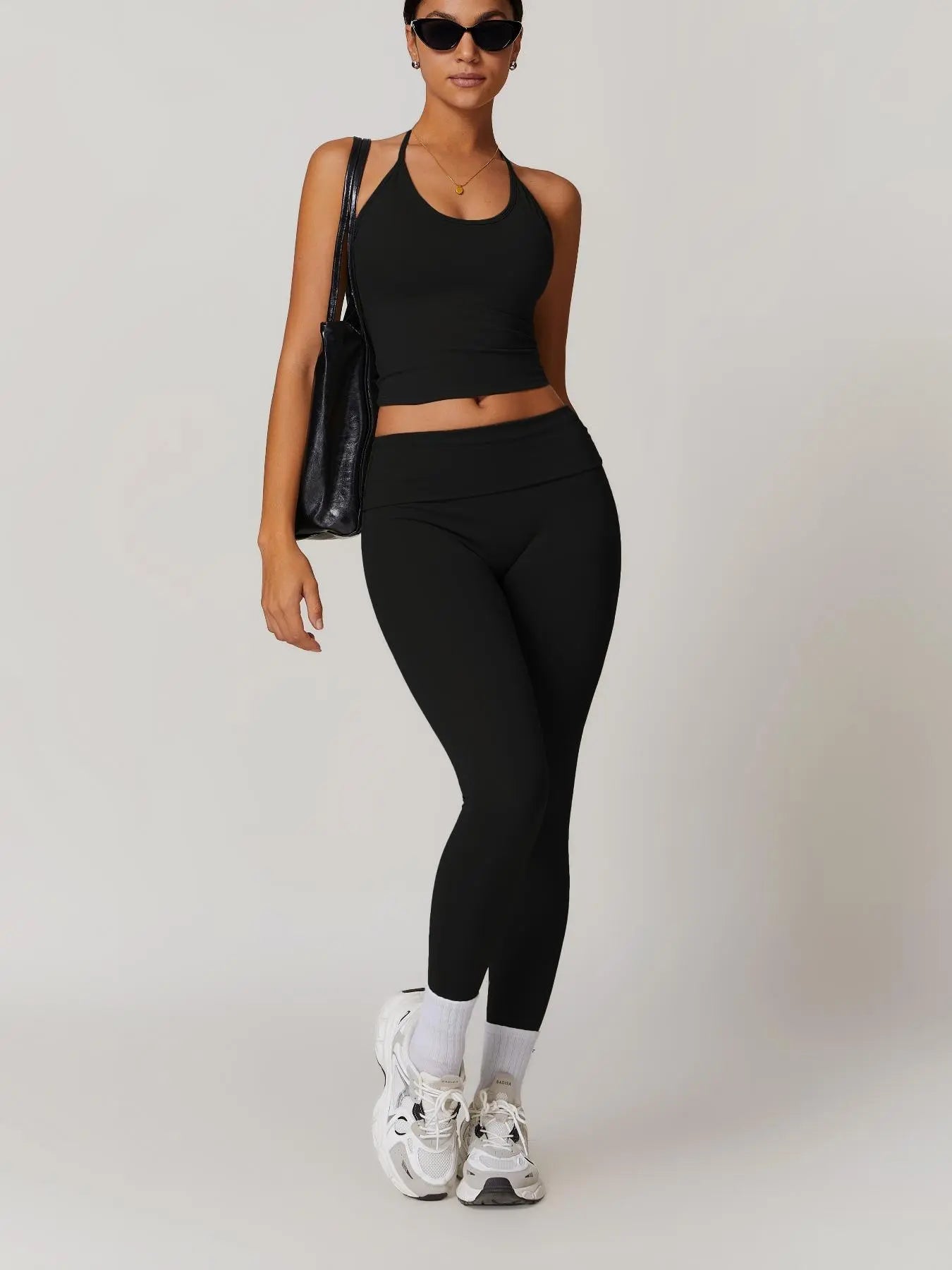 Two-Piece Set Women's Solid Backless Halter Crop Top & Fold Over Waist Leggings Tracksuit Set, Casual…